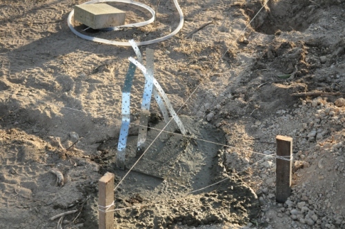 Concreted corner post foundations